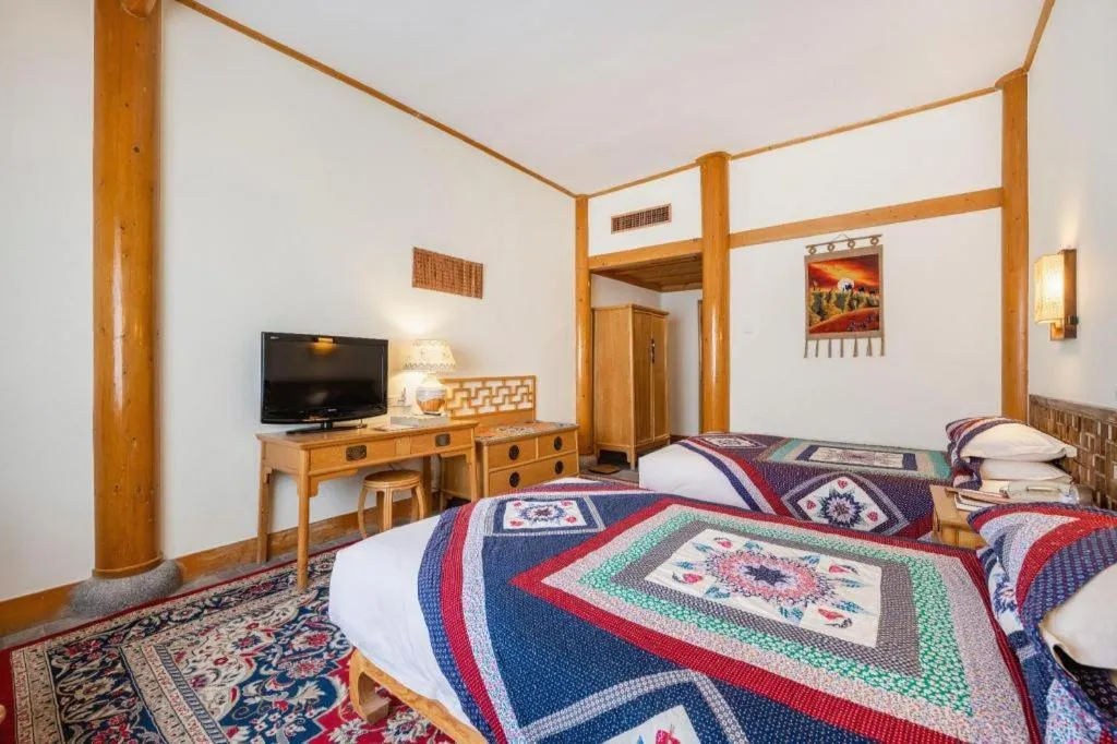 Bed in The Silk Road Dunhuang Hotel