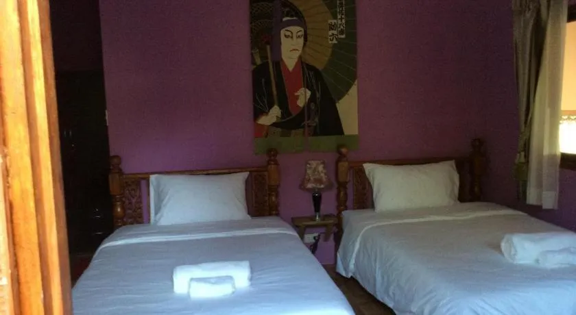 Bed in Himawari Restaurant and Cottage