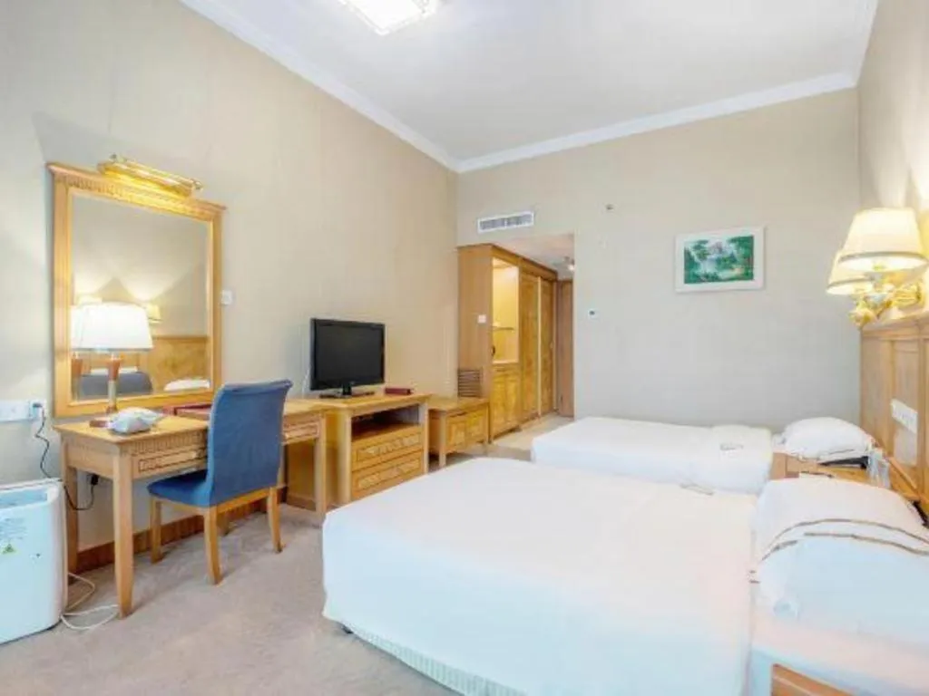 Bed in Zhuhai Dehan Hotel