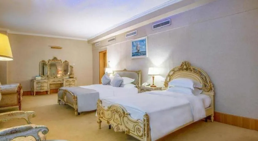 Bed in Zhuhai Dehan Hotel