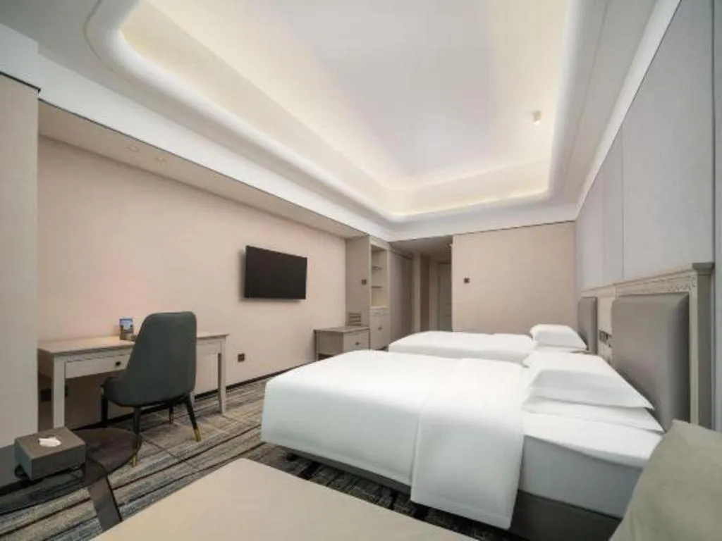 Bed in Zhuhai Dehan Hotel