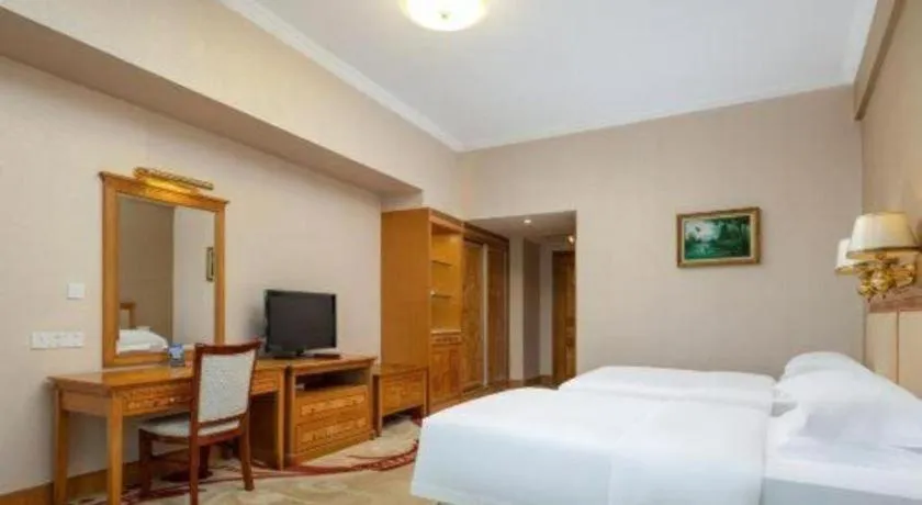 Bed in Zhuhai Dehan Hotel