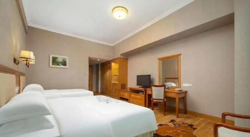 Bed in Zhuhai Dehan Hotel