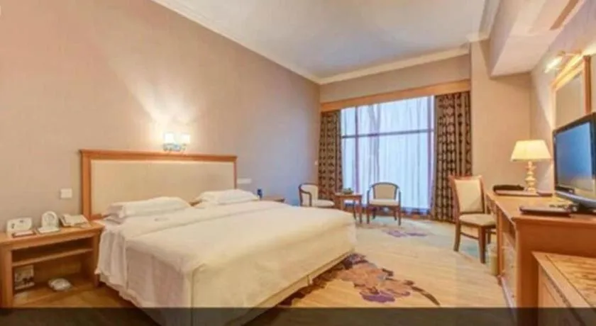 Bed in Zhuhai Dehan Hotel