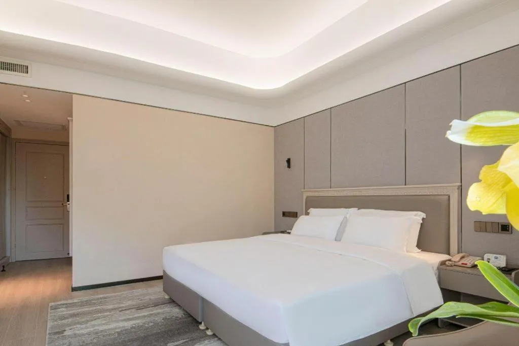 Bed in Zhuhai Dehan Hotel