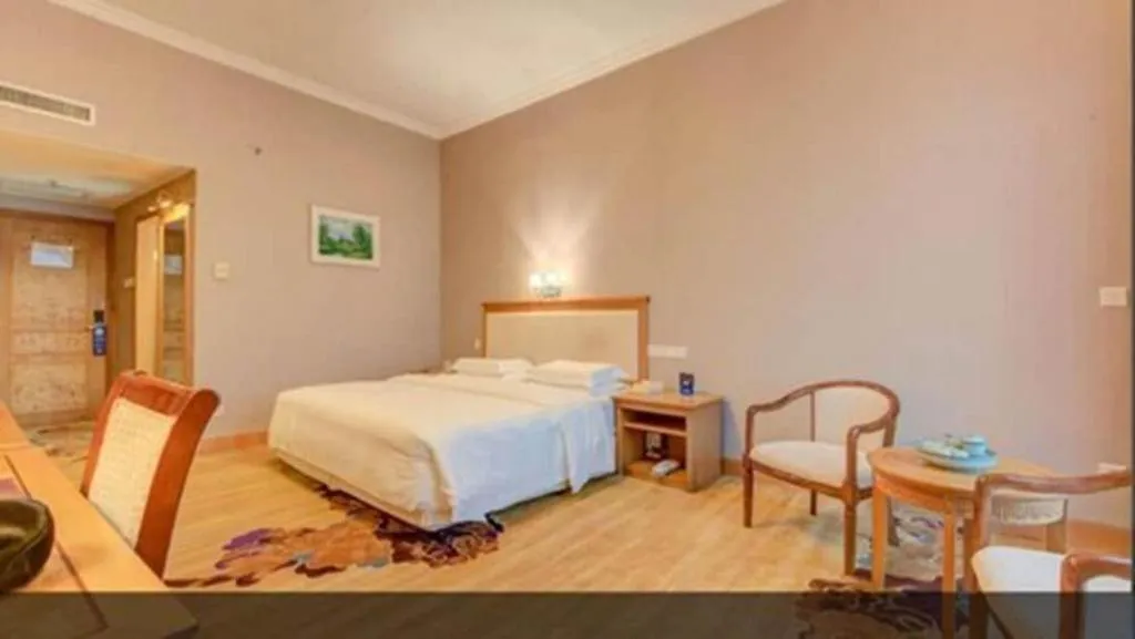 Bed in Zhuhai Dehan Hotel