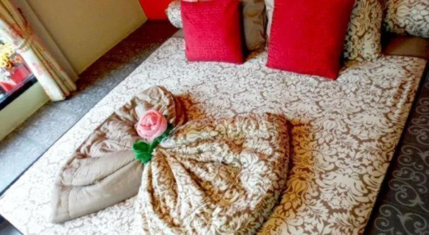 Bed in Sweet Garden Home Resort