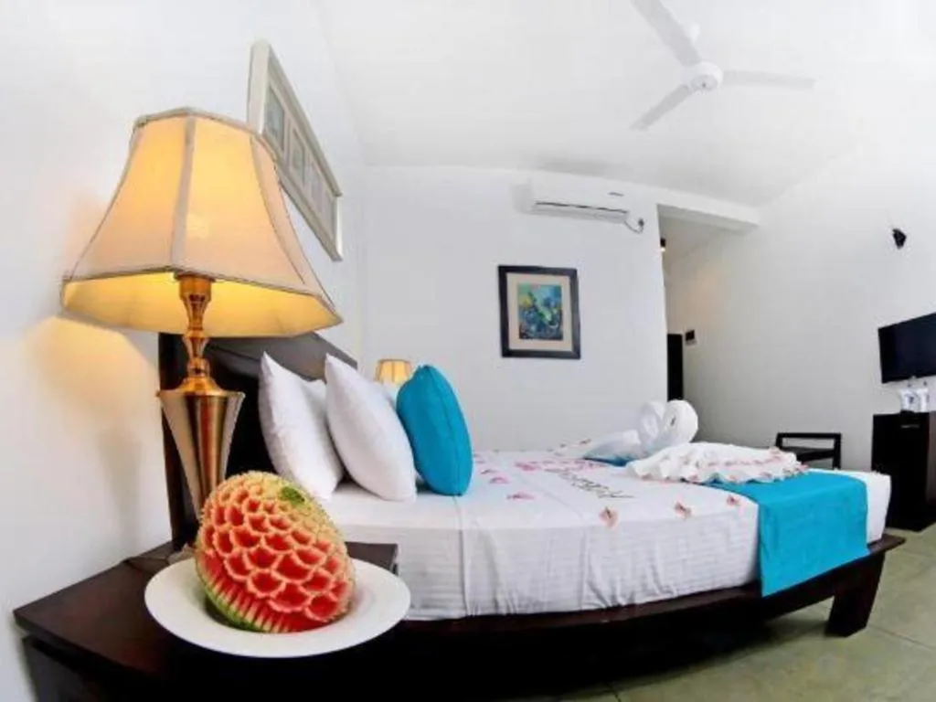 Bed in Coco Royal Beach Resort