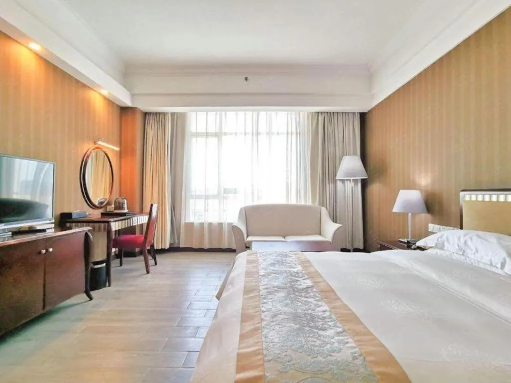 Bed in Hua Xia Pearl Hotel