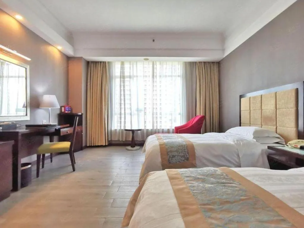 Bed in Hua Xia Pearl Hotel