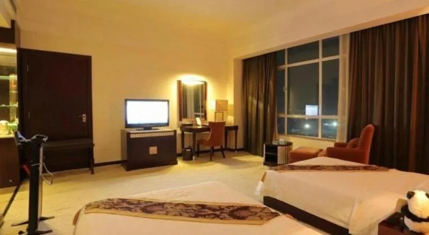 Bed in Hua Xia Pearl Hotel