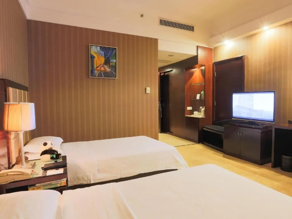 Bed in Hua Xia Pearl Hotel