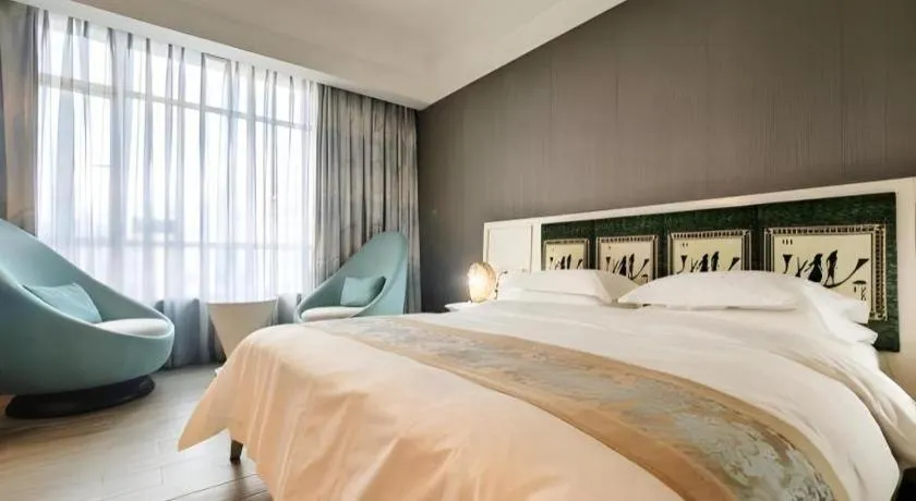 Bed in Hua Xia Pearl Hotel