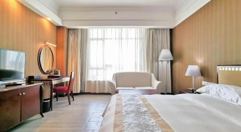 Bed in Hua Xia Pearl Hotel