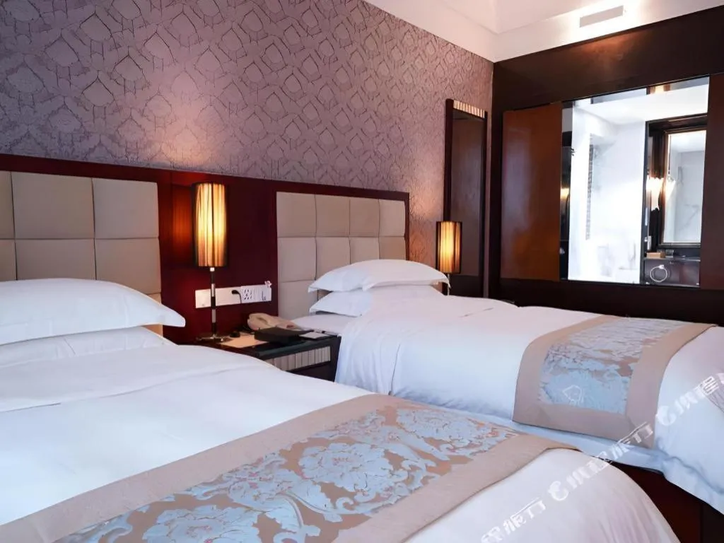 Bed in Hua Xia Pearl Hotel