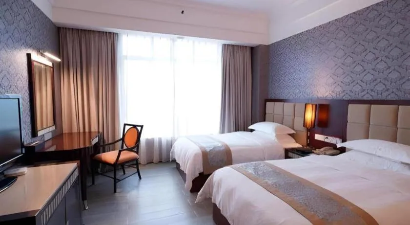 Bed in Hua Xia Pearl Hotel