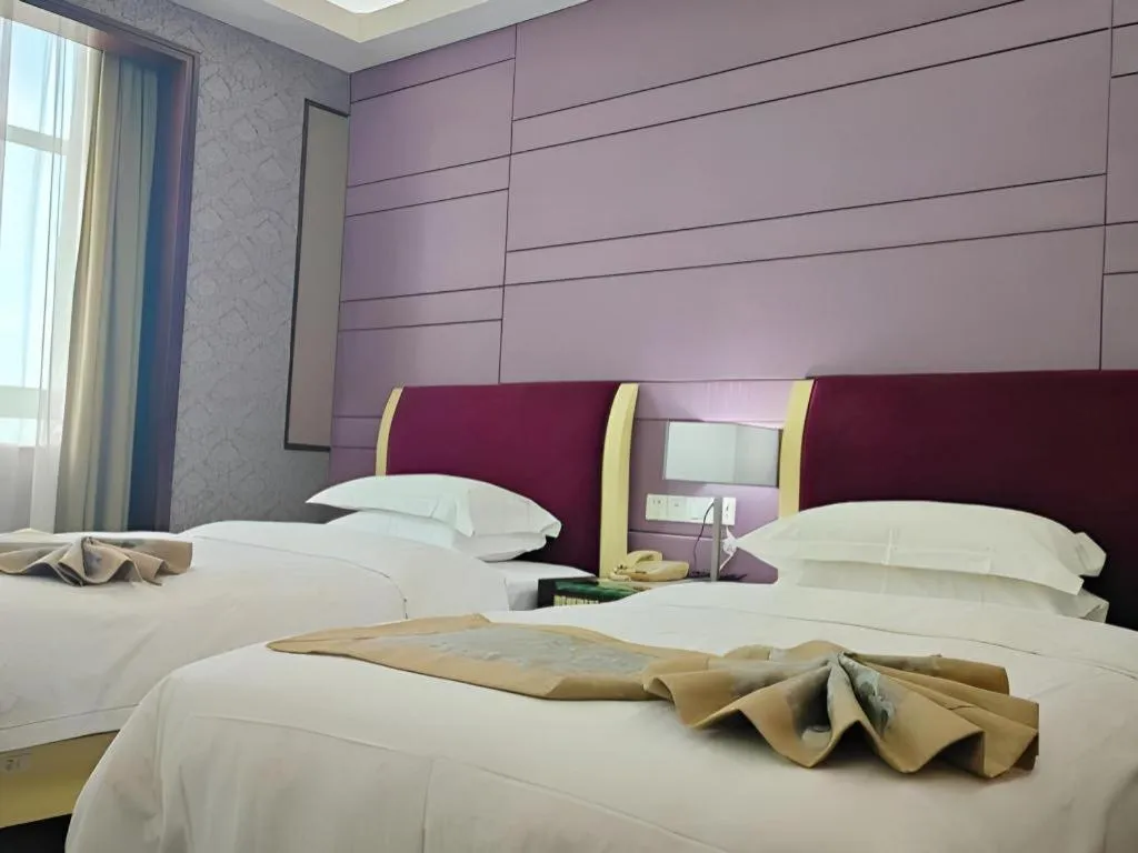 Bed in Hua Xia Pearl Hotel