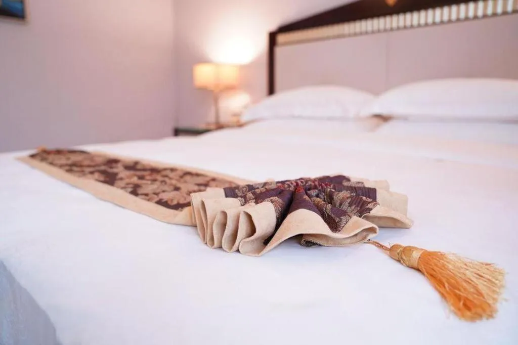 Bed in Hua Xia Pearl Hotel