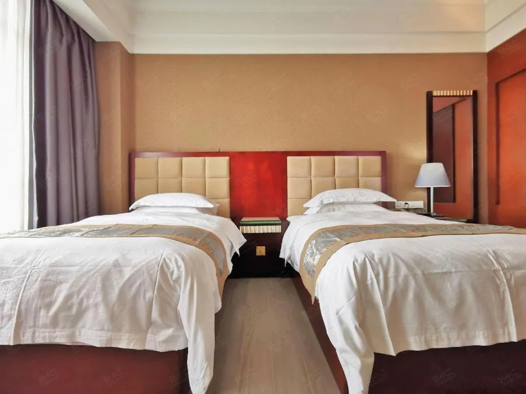Bed in Hua Xia Pearl Hotel