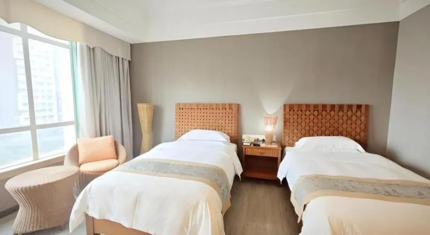 Bed in Hua Xia Pearl Hotel