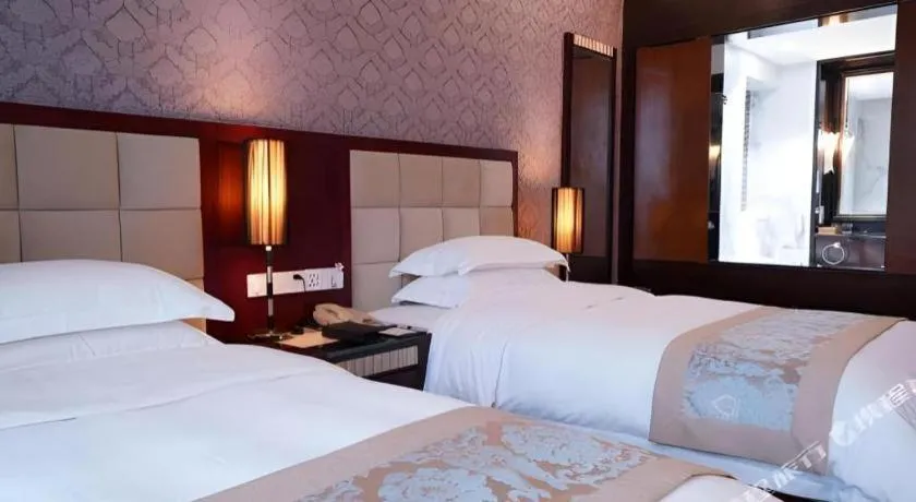 Bed in Hua Xia Pearl Hotel