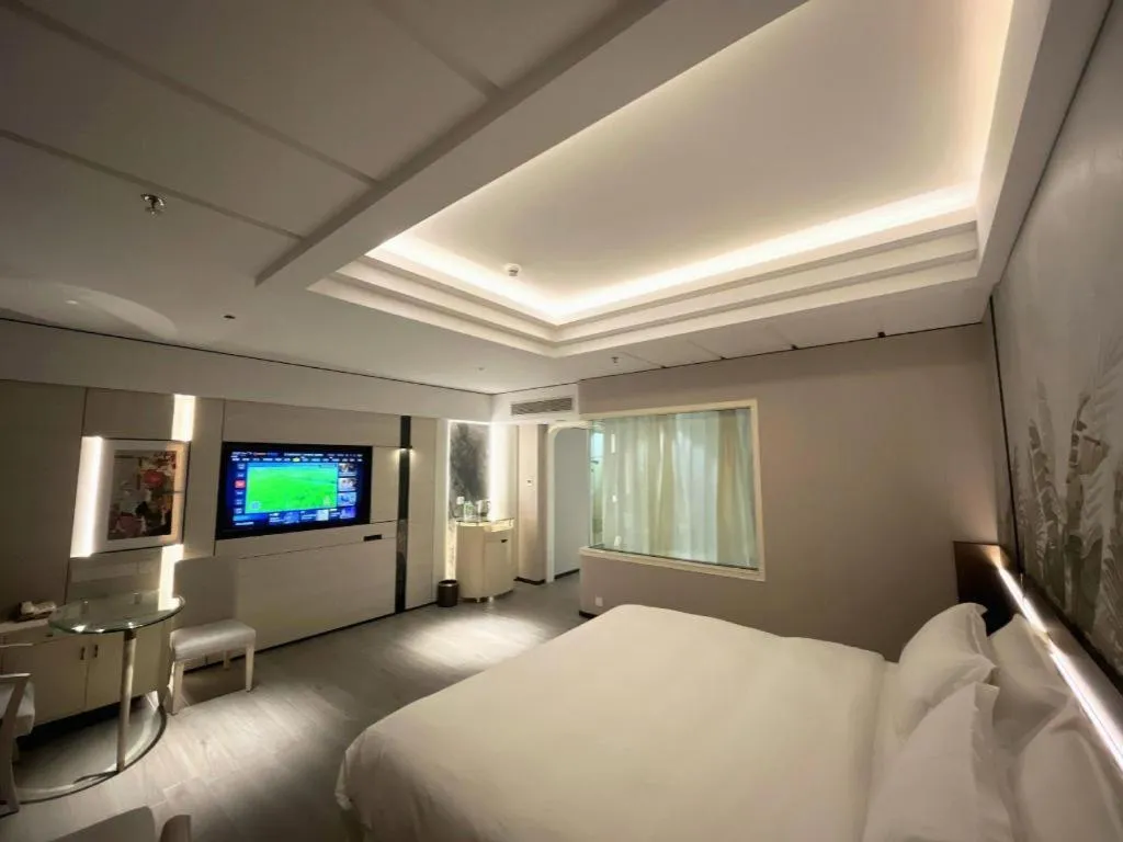 Bed in Hua Xia Pearl Hotel