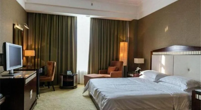 Bed in Hua Xia Pearl Hotel