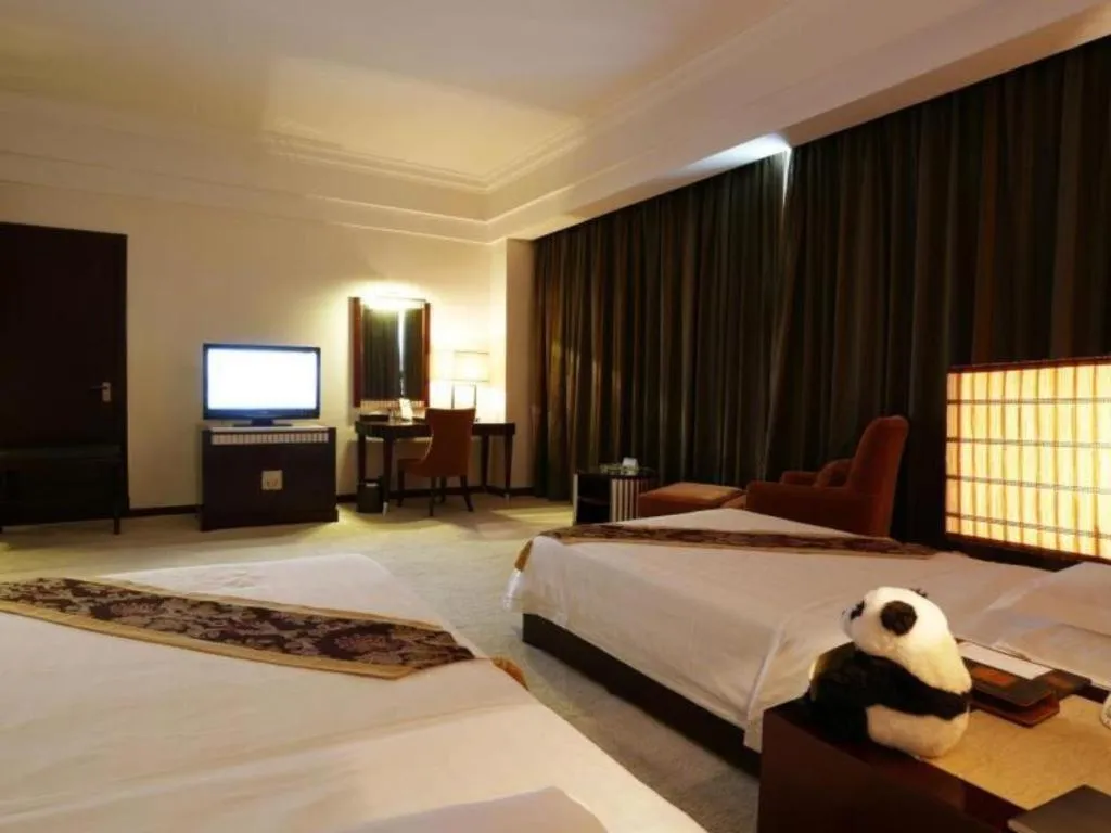 Bed in Hua Xia Pearl Hotel