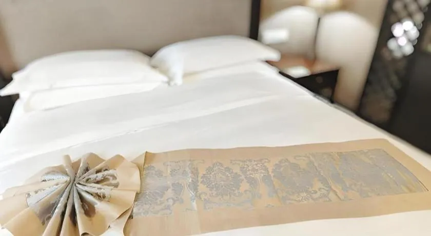 Bed in Hua Xia Pearl Hotel