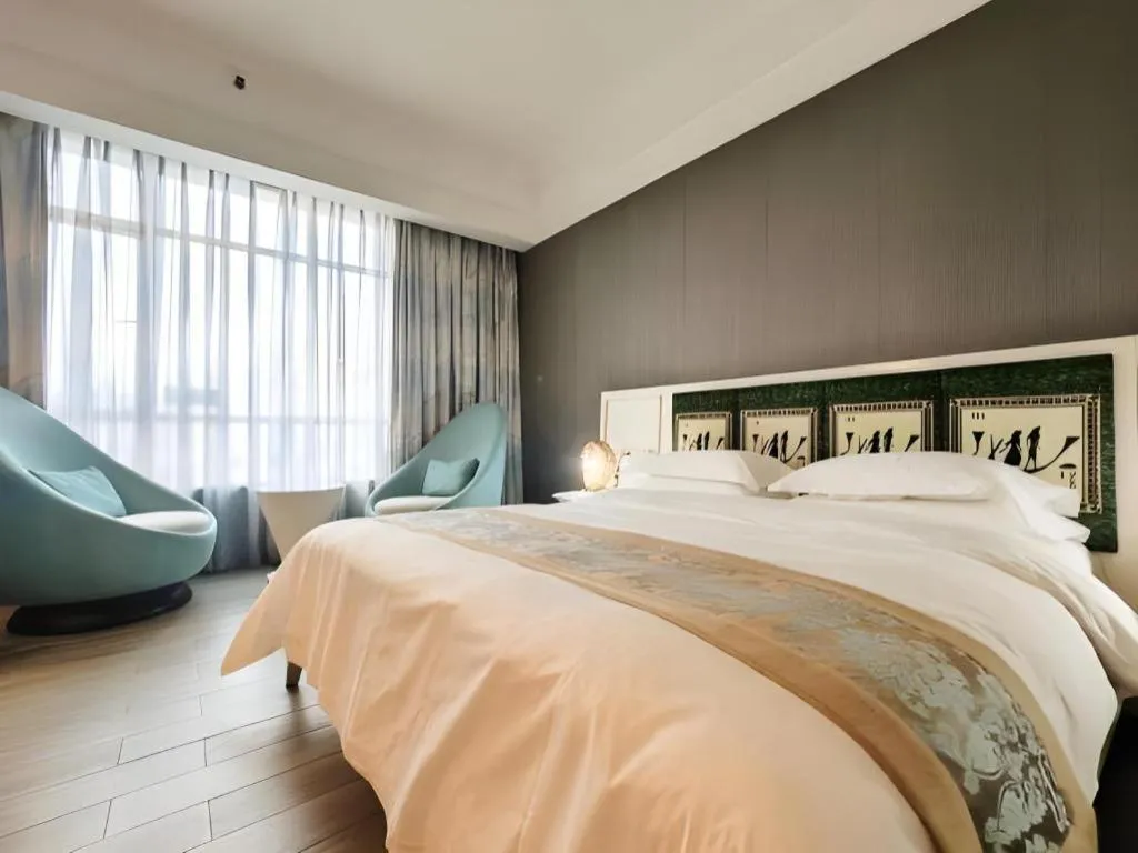 Bed in Hua Xia Pearl Hotel