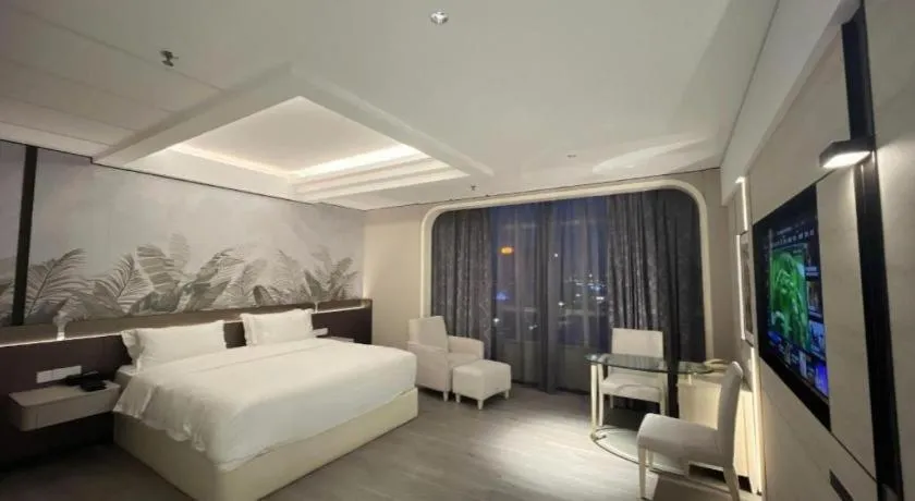 Bed in Hua Xia Pearl Hotel