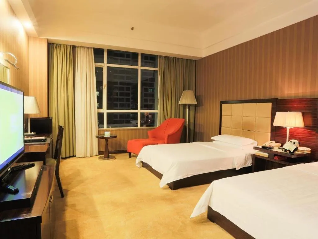 Bed in Hua Xia Pearl Hotel