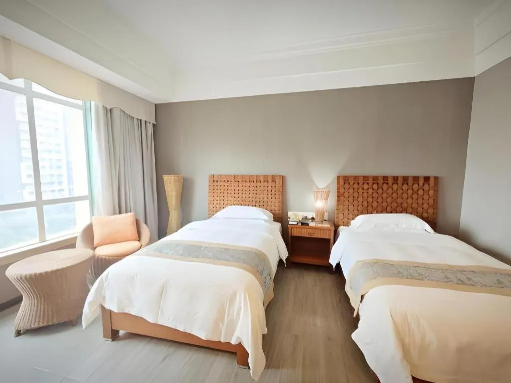 Bed in Hua Xia Pearl Hotel