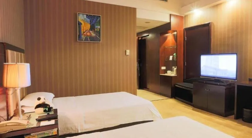 Bed in Hua Xia Pearl Hotel