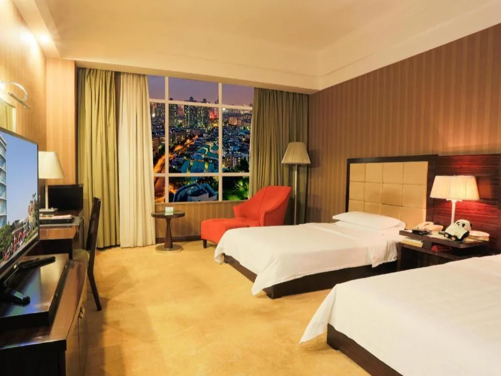 Bed in Hua Xia Pearl Hotel