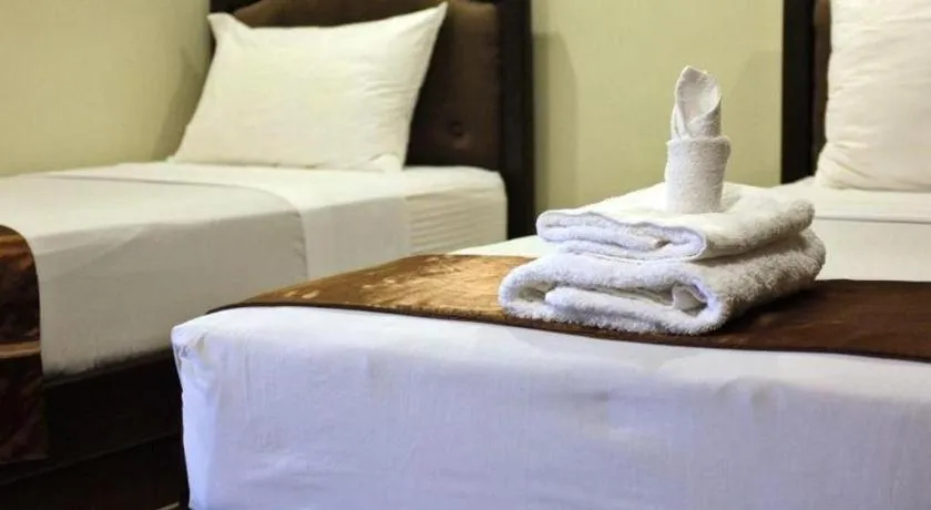 Bed in Peridot Suites