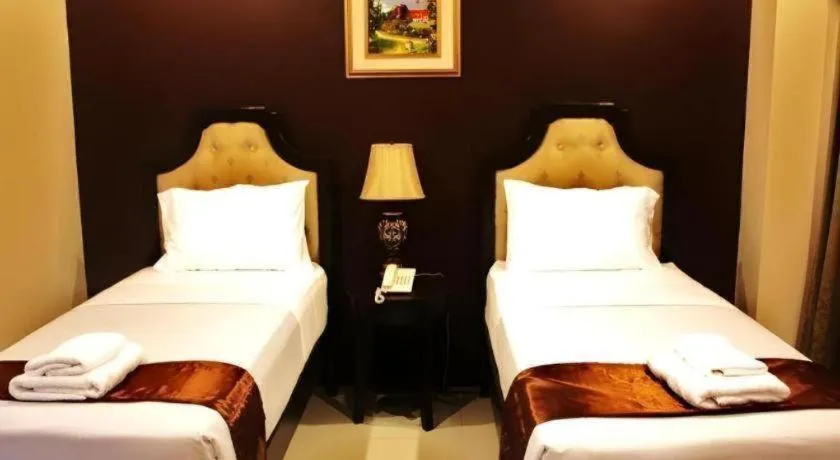 Bed in Peridot Suites