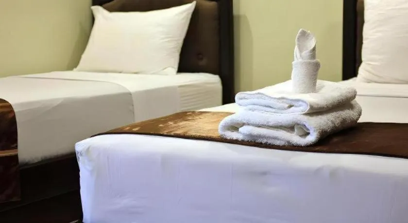 Bed in Peridot Suites