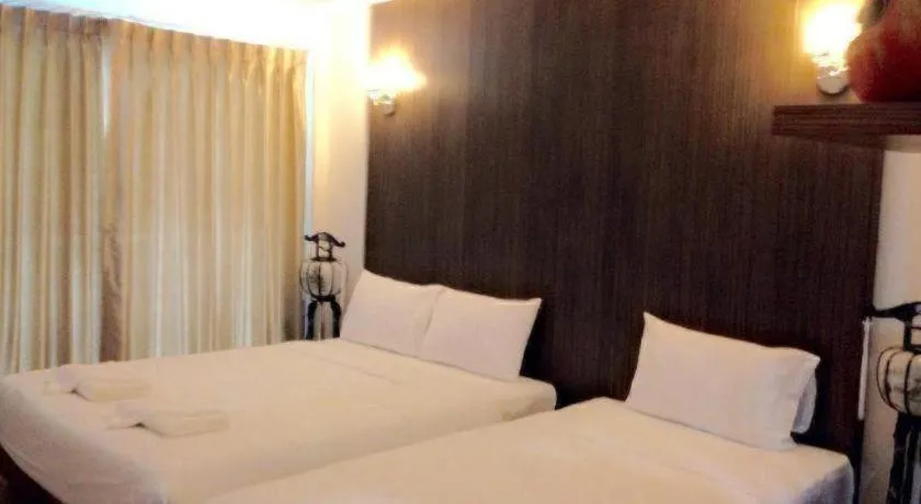 Bed in The Pride Hotel At Laemsing