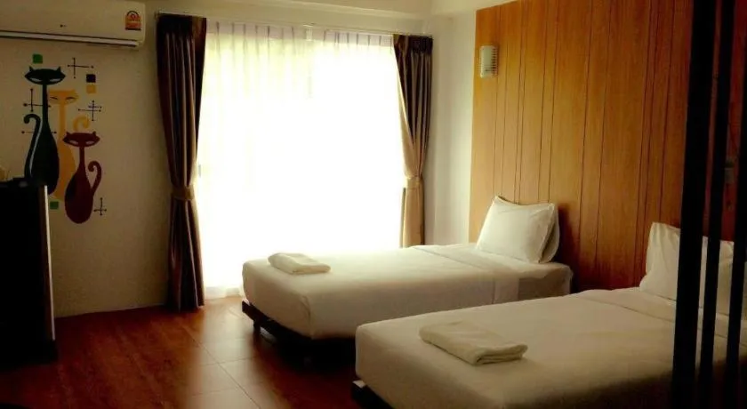 Bed in The Pride Hotel At Laemsing