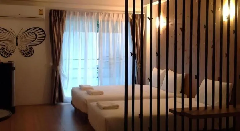 Bed in The Pride Hotel At Laemsing