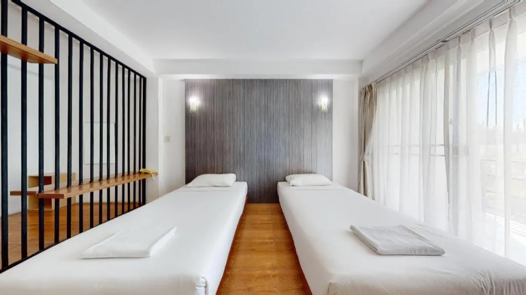 Bed in The Pride Hotel At Laemsing