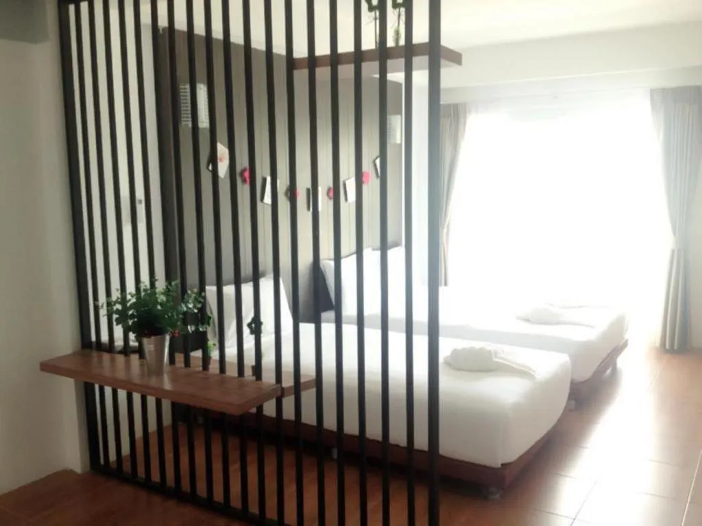 Bed in The Pride Hotel At Laemsing