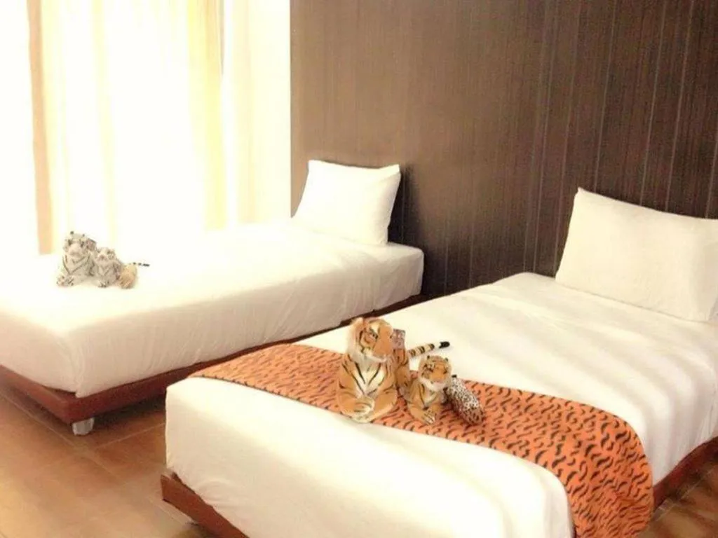 Bed in The Pride Hotel At Laemsing