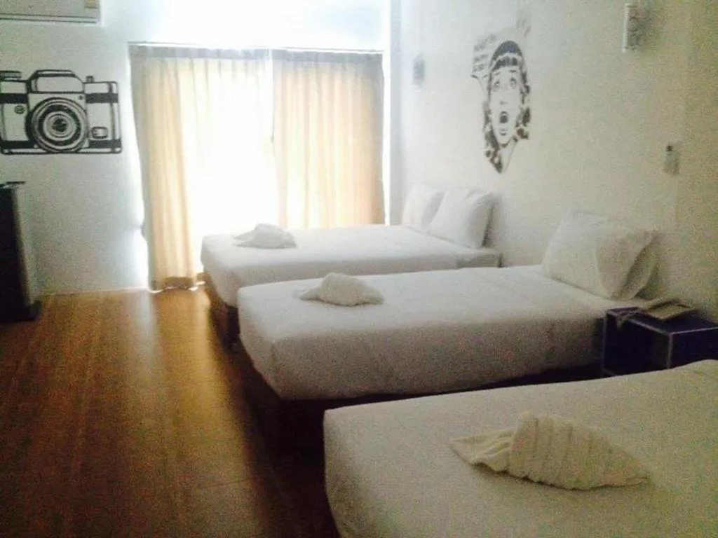 Bed in The Pride Hotel At Laemsing