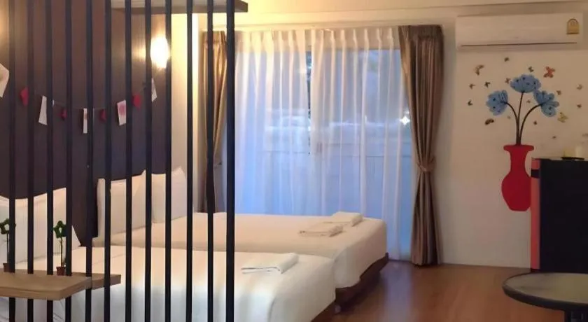 Bed in The Pride Hotel At Laemsing