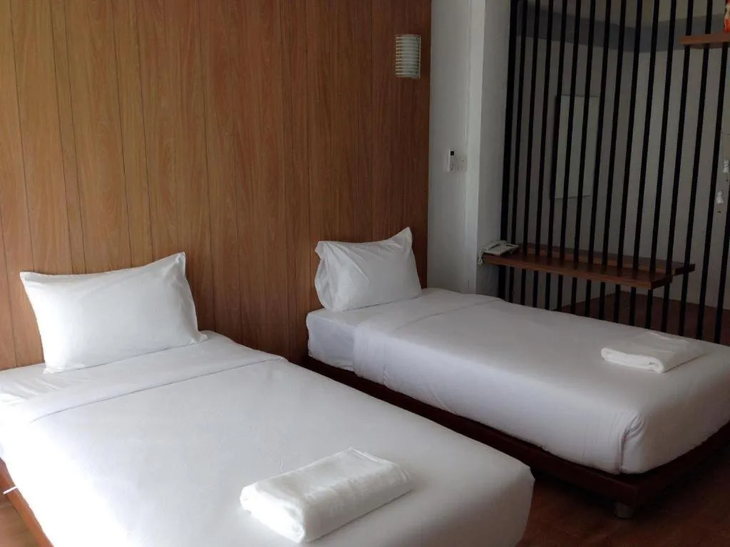 Bed in The Pride Hotel At Laemsing