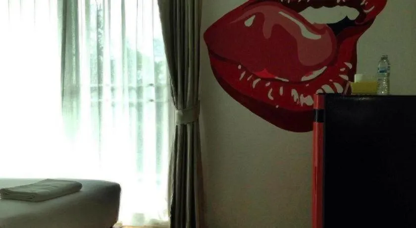 Bed in The Pride Hotel At Laemsing