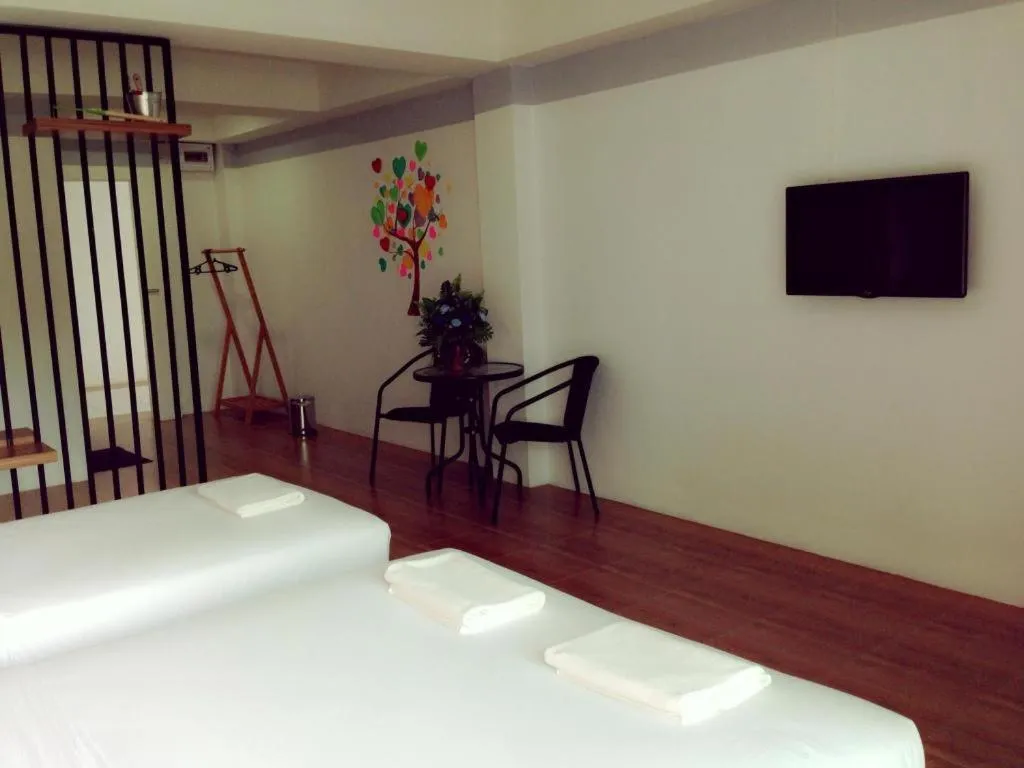 Bed in The Pride Hotel At Laemsing