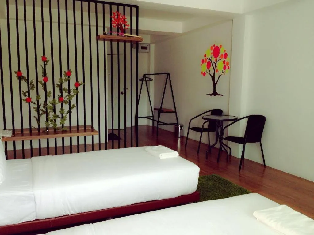 Bed in The Pride Hotel At Laemsing